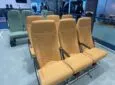 Acro Series 6 seat triples, two in yellow, and behind it one row of green